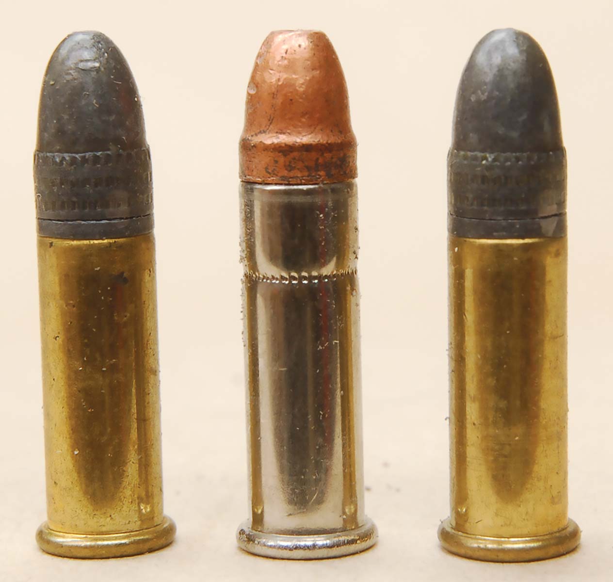 The CCI Stinger's 0.1-inch longer case (center) and shorter bullet are obvious when compared to the common 22 LR on either side.